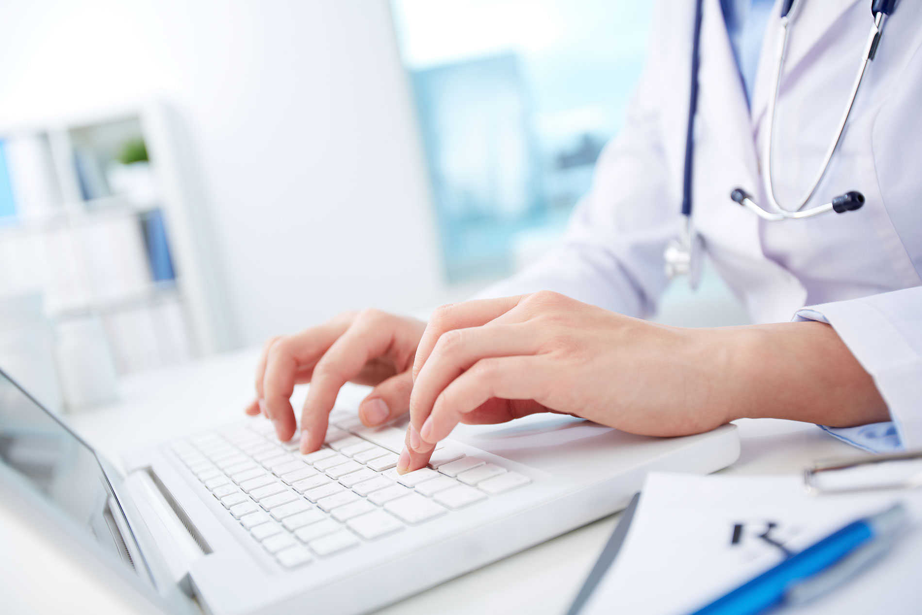 urgent-care-doctor-typing-notes