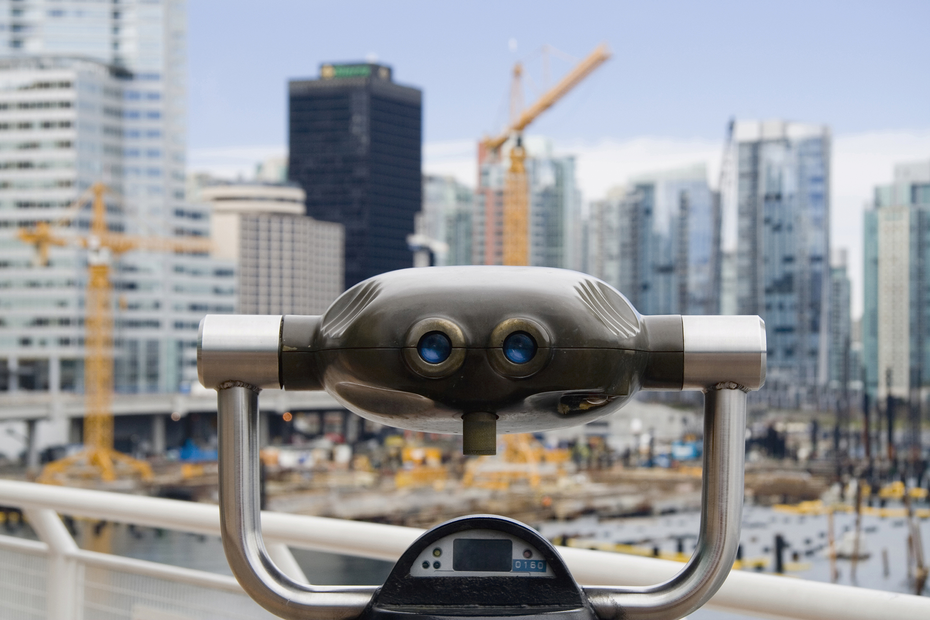 binoculars viewing a cities growth