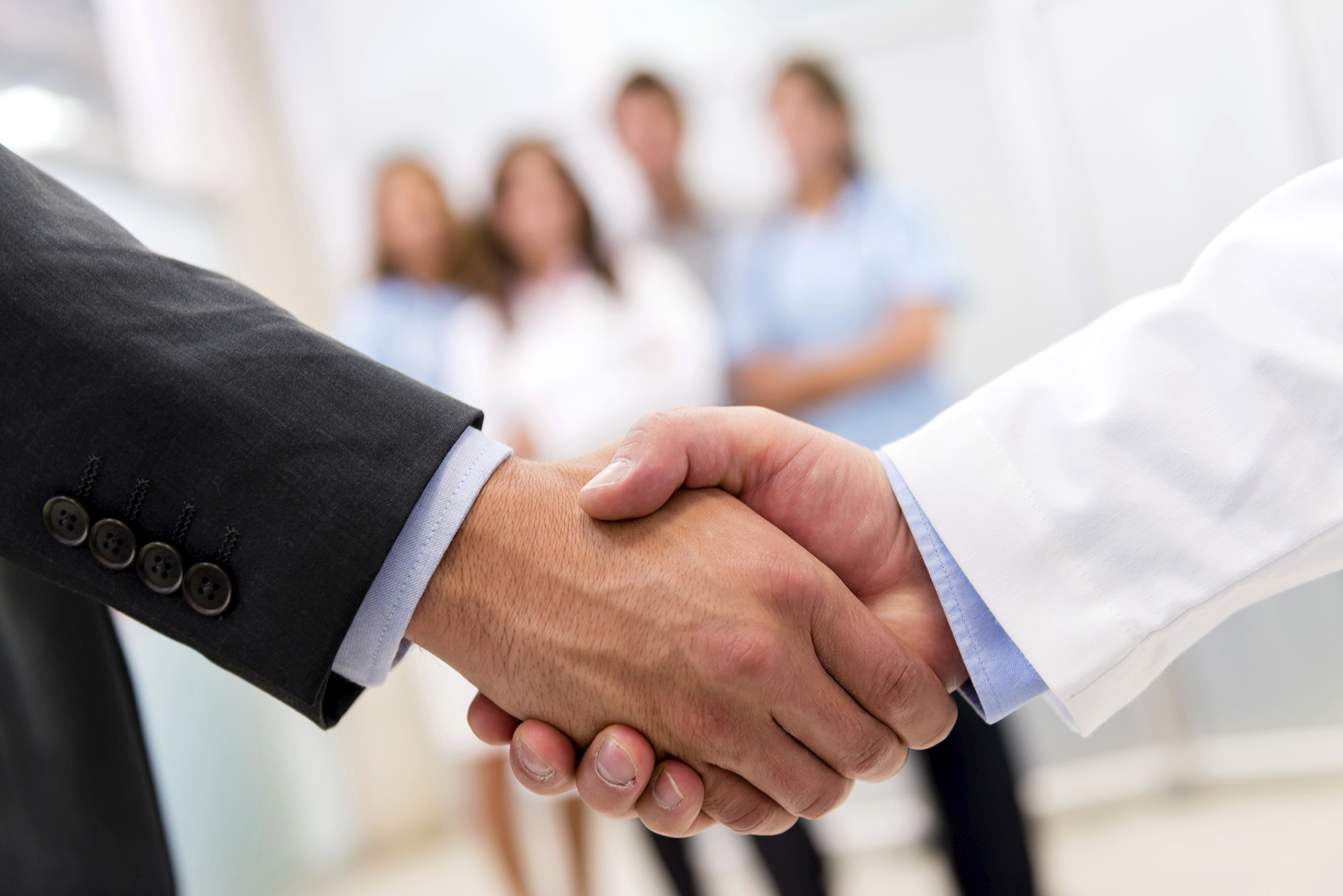 decision makers shaking hands