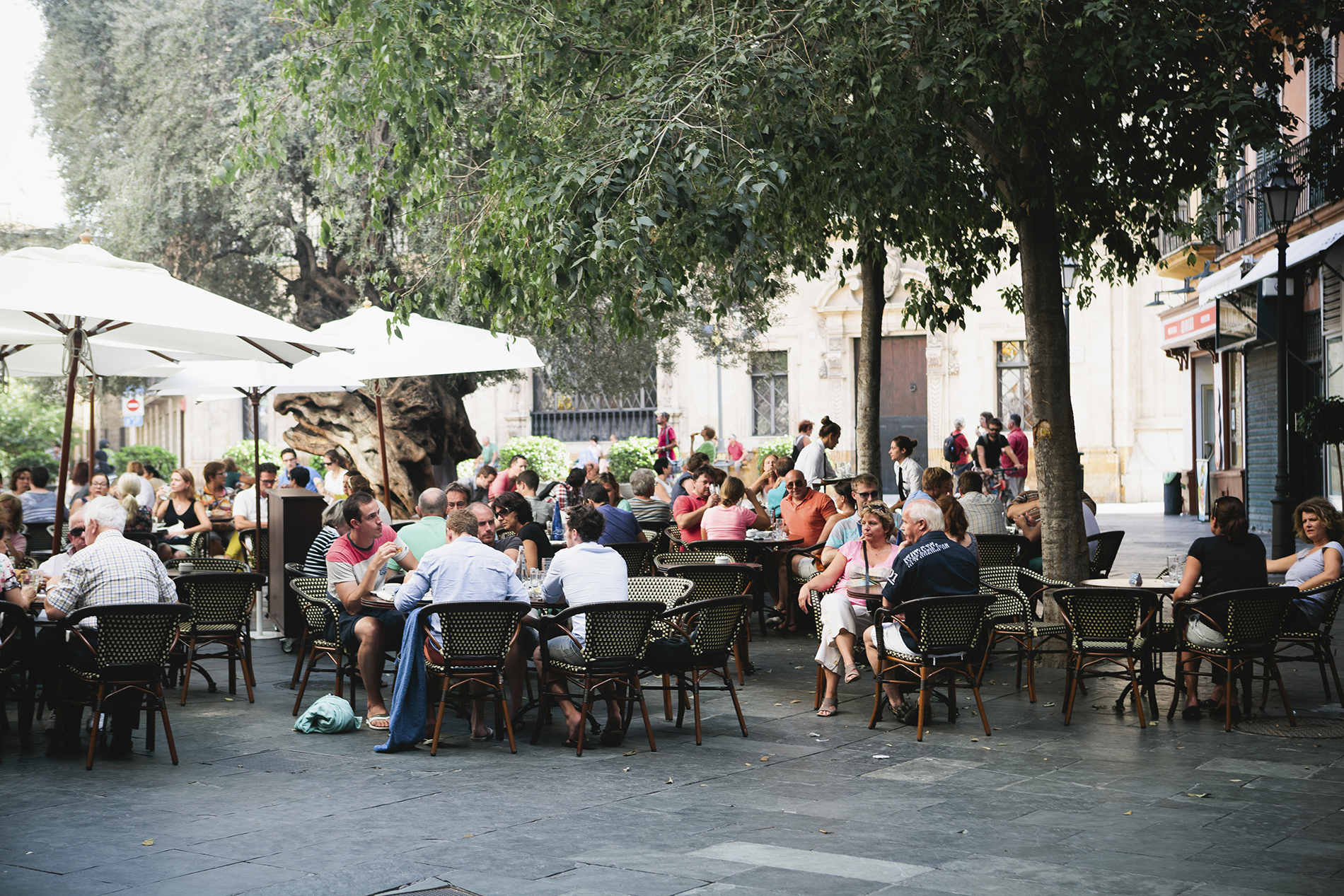 numerous tables of customers dining outside