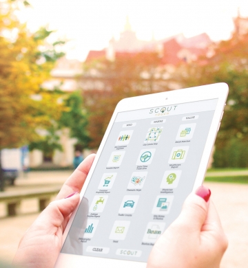woman looking at SCOUT Touch for city government on a tablet device
