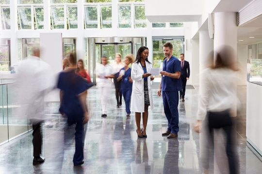 doctors reviewing patient analytics to forecast performance